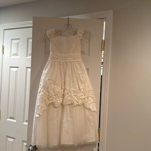 Beautiful cream, flower girl or bridesmaid dress designer is Joan calabrese